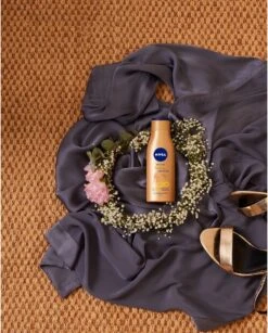 NIVEA Q10 Firming + Bronze Body Lotion - 400 Ml 12 NIVEA Q10 Firming + Bronze Body Lotion - 400 Ml -Verzorgingsvoordeel Huis 964x1200